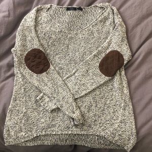 Cozy neutral sweater with elbow patches
